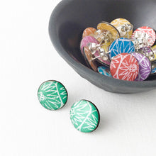 Load image into Gallery viewer, A green pair of large stud earrings handmade from silver, paper and resin by Dittany Rose